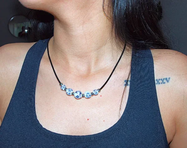 Handmade floral ceramic necklace with genuine leather & stainless steel accents