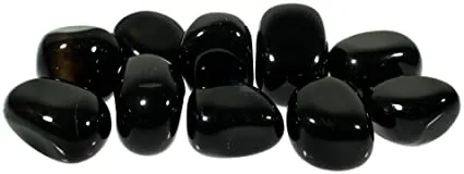Group of polished tumbled black agate energy stones with a high-gloss reflective finish.