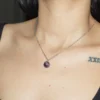 Amethyst sphere pendant necklace for spiritual healing and protection.