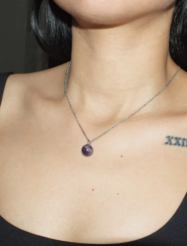 Amethyst sphere pendant necklace for spiritual healing and protection.