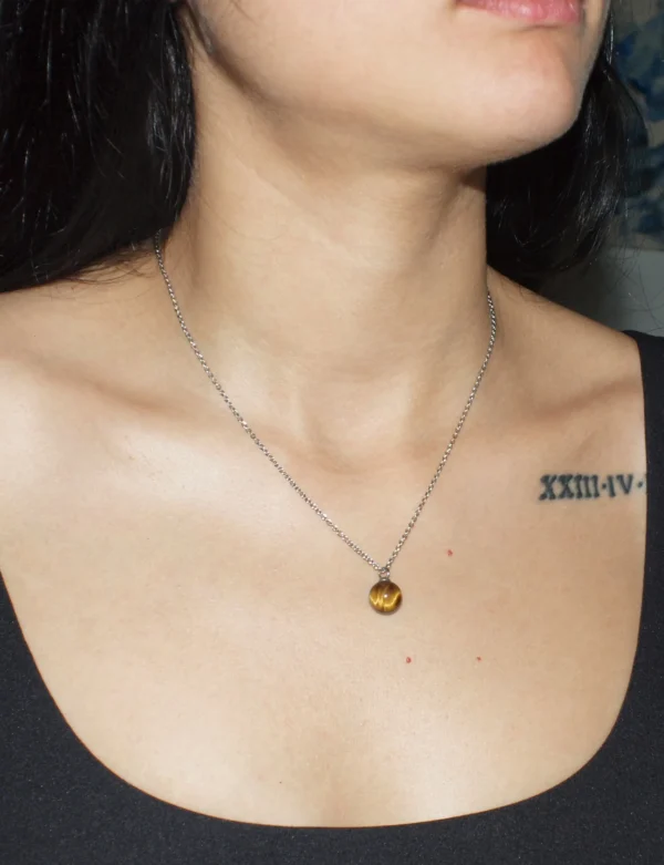 Tiger's Eye sphere pendant necklace for protection and confidence.